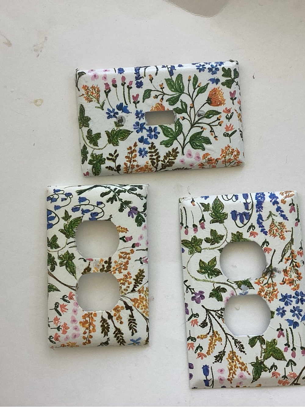 Hand decorated switch plate and outlet covers
